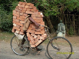 a man carrying bricks