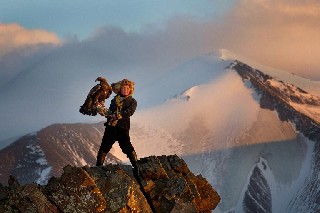 Amazing Picture of a Girl and her Hunting Eagle Altai Mountain Range